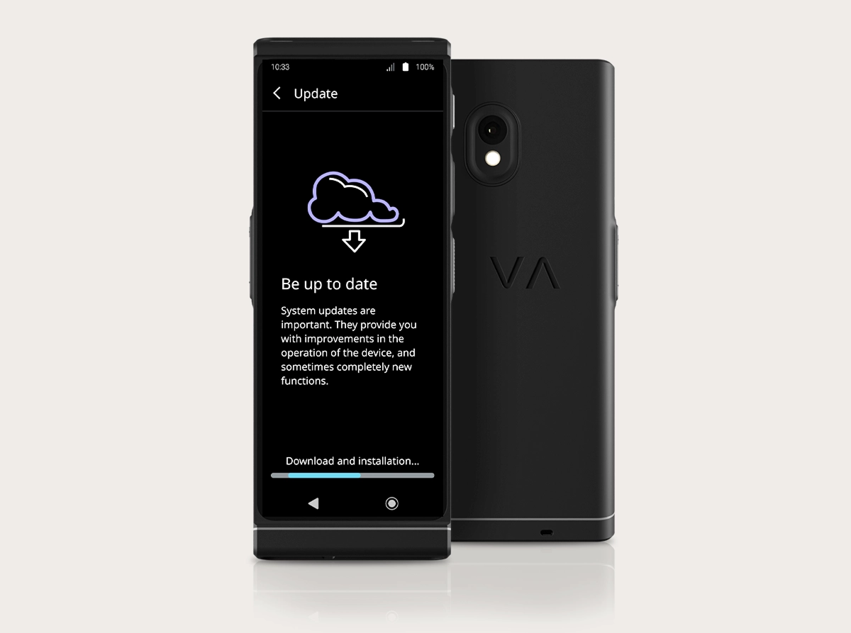 A studio product photo of the Vasco Translator V4 showing the system update interface. Two black devices are positioned side-by-side: one facing forward and one showing the back. The screen displays a cloud icon with a download arrow, the heading 